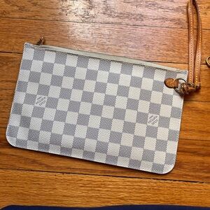 Louis Vuitton neverfull pouch.